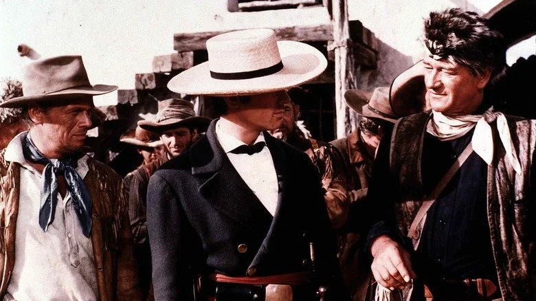 Jim Bowie, William Travis, and Davy Crockett stand together