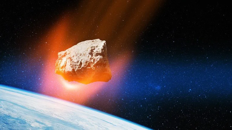 astéroïde enflammé dans l'espace au-dessus de la Terre