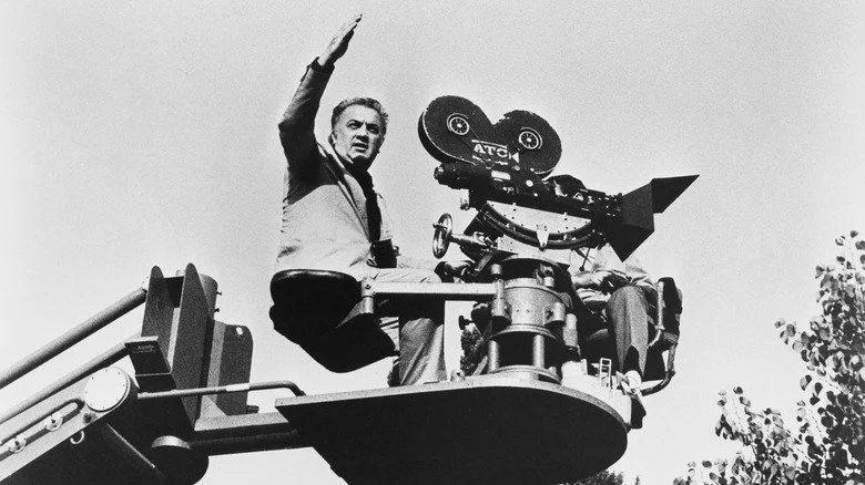 Federico Fellini rides a camera crane