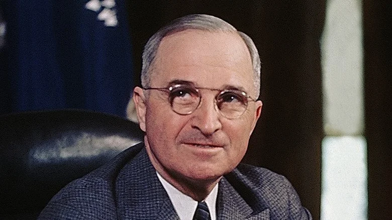 Former U.S. President Harry S. Truman seated at his desk