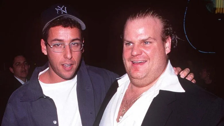 Adam Sandler with glasses embracing Chris Farley