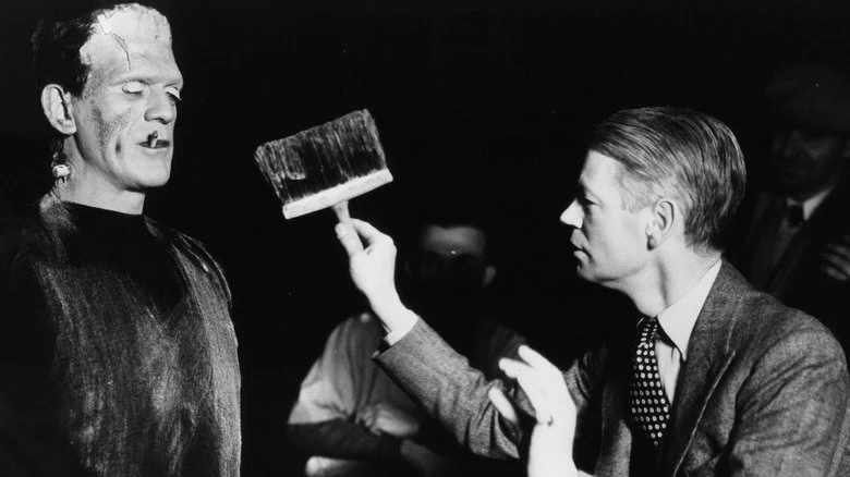 James Whale holds a brush up to Boris Karloff