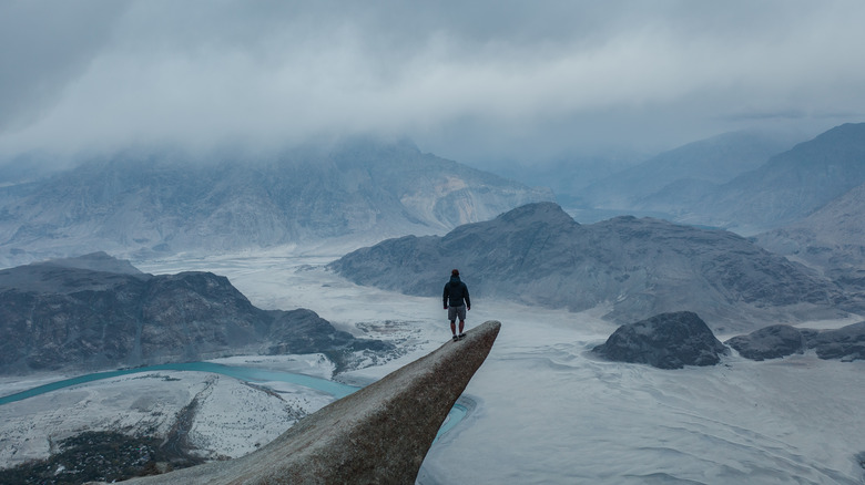 Climber overlooking Himalayas
