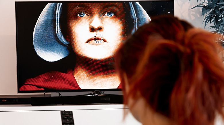 woman watching the handmaid's tale