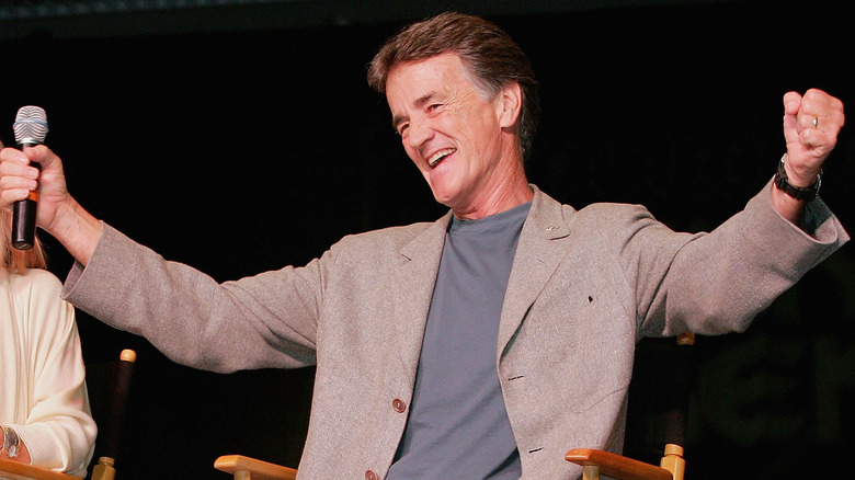 Robert Walker Jr. arms wide smiling