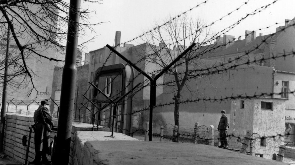 East and West German guards at the Berlin Wall