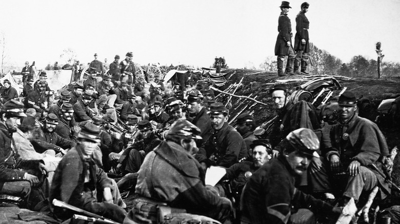 Civil War soldiers sitting in trench