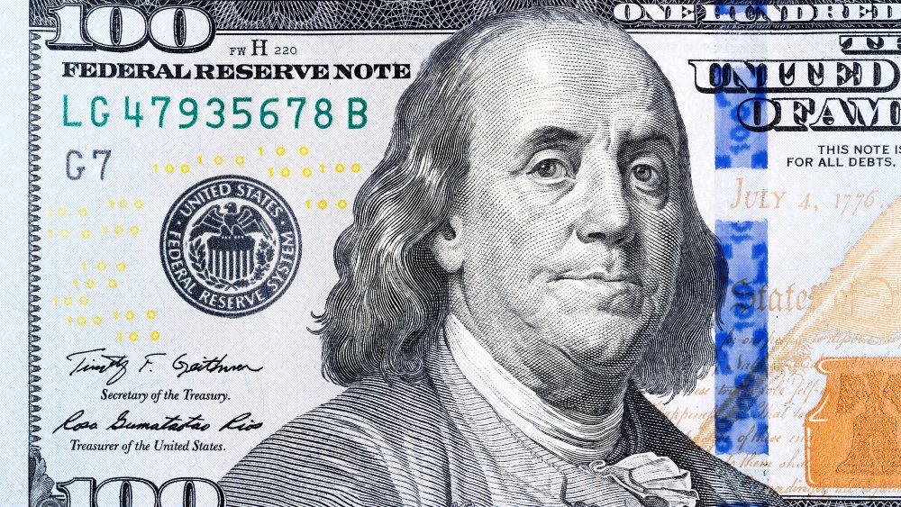 Benjamin Franklin, billet de 100 dollars et symbole de richesse, millionnaire